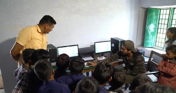 Village children at computers for the first time in nine years