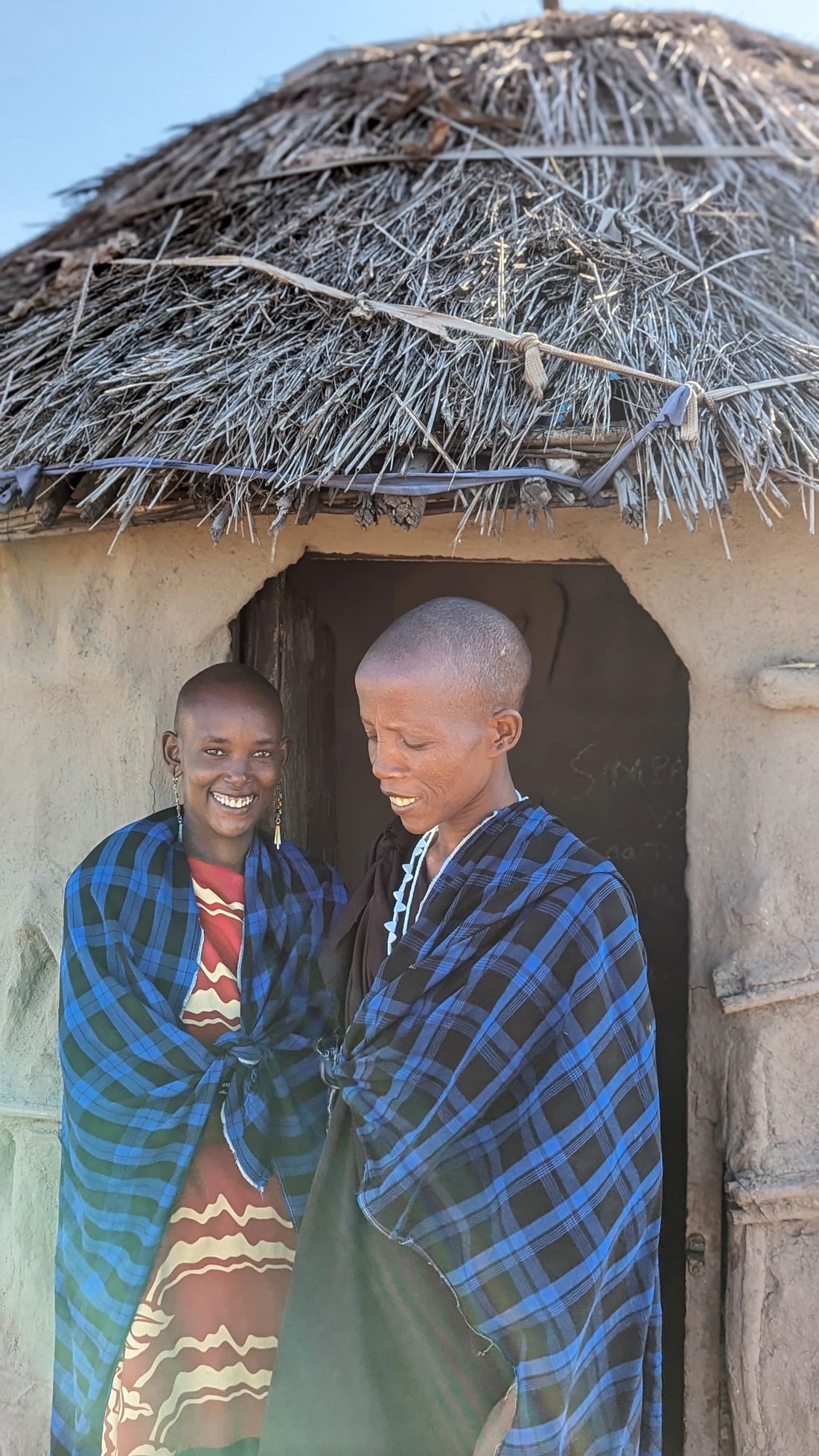 Maasai women outside their home; community encounters are part of the expedition